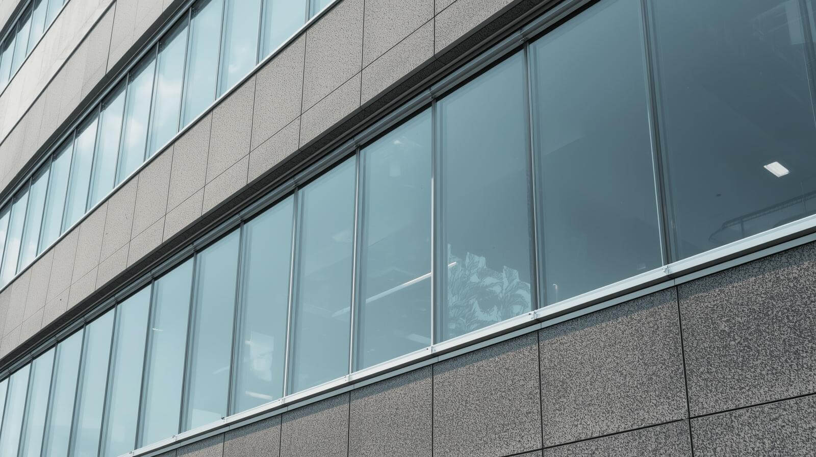 Aluminum fixed glass window installed on modern office building façade for clear daylight and insulation-vigorawindows.com
